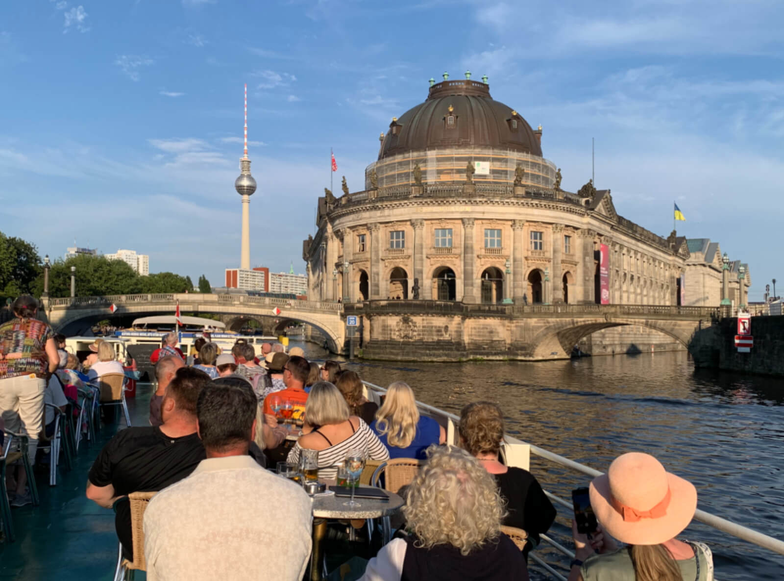 Waiter serving a cocktail for elegant clients in a nice bar